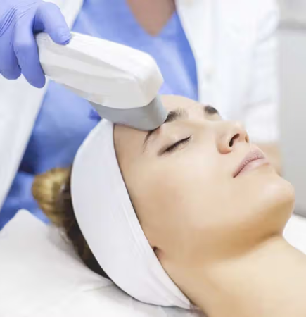 Woman receiving a form of laser treatment on eyebrows
