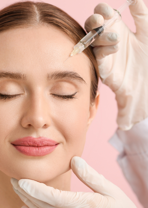 Woman Getting face treatment with a needle